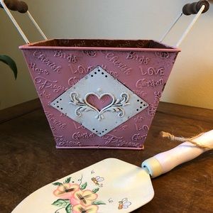 Adorable pink tin with heart accent.